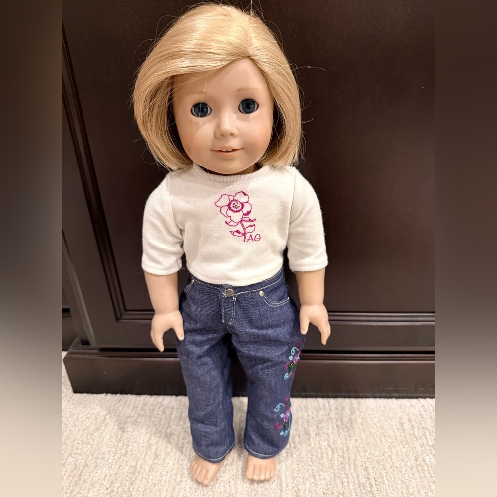 American Girl outfit with embroidered jeans and flower top